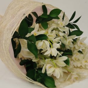 white orchids with a straw wrapping
