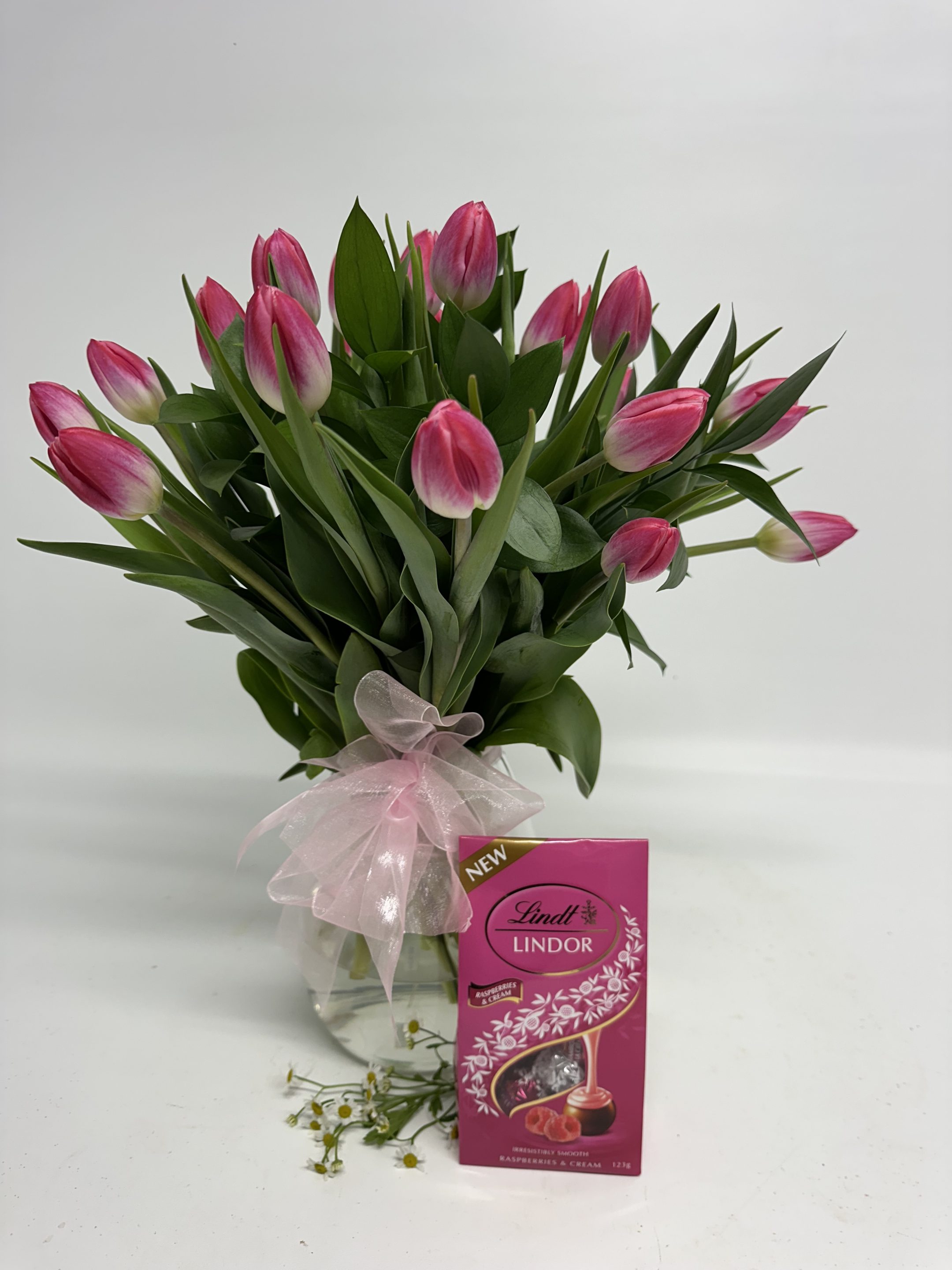 Tulips glass vase and chocolates