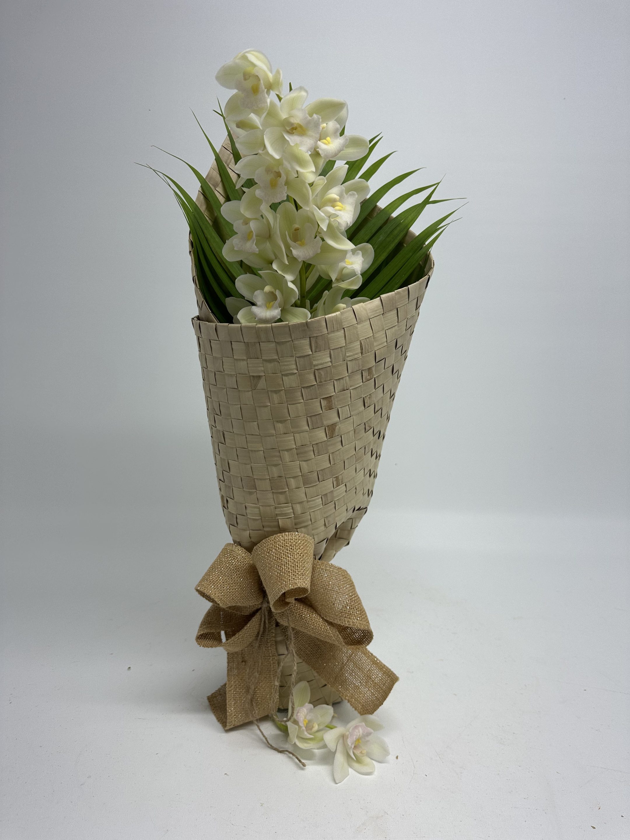 single white orchids in kete