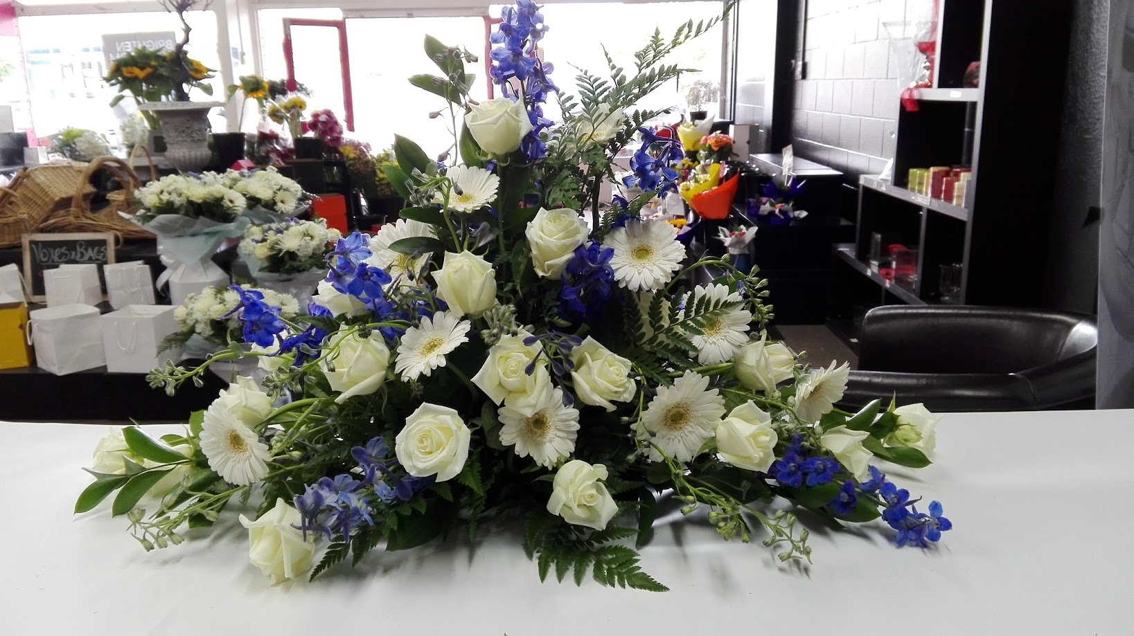 blue white casket spray 3