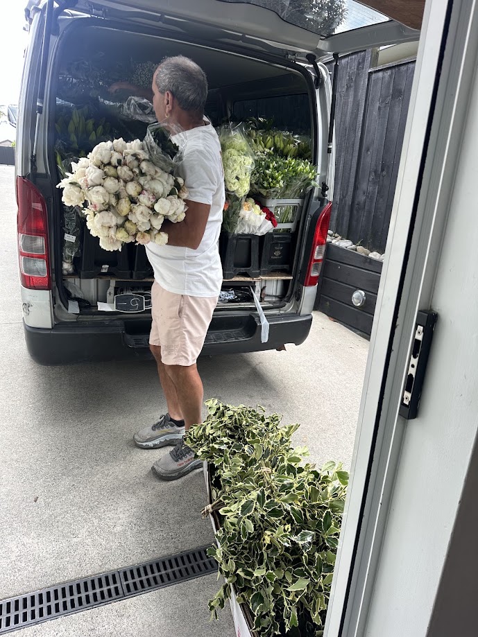 Loading fresh flowers into the Jan Maree Flowers van
